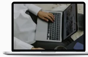 Laptop showing someone working on a laptop