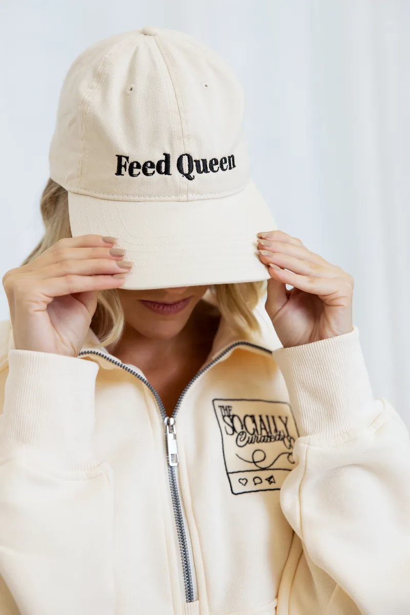 Alyson wearing a Feed Queen cap